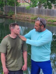 Chaplain Gene Palmo interviews a resident prior to baptism.